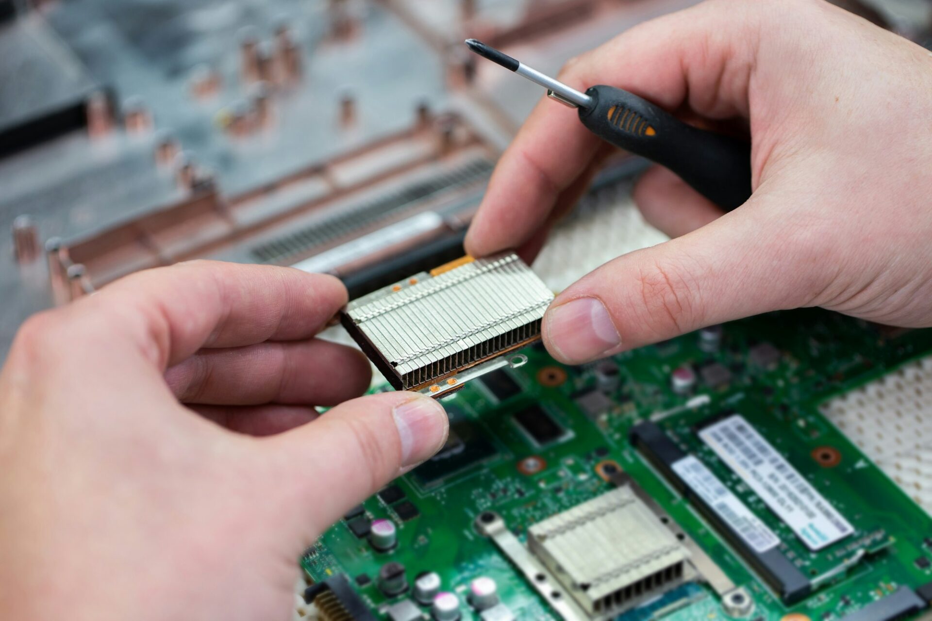 Technician repairing a laptop in the service centre